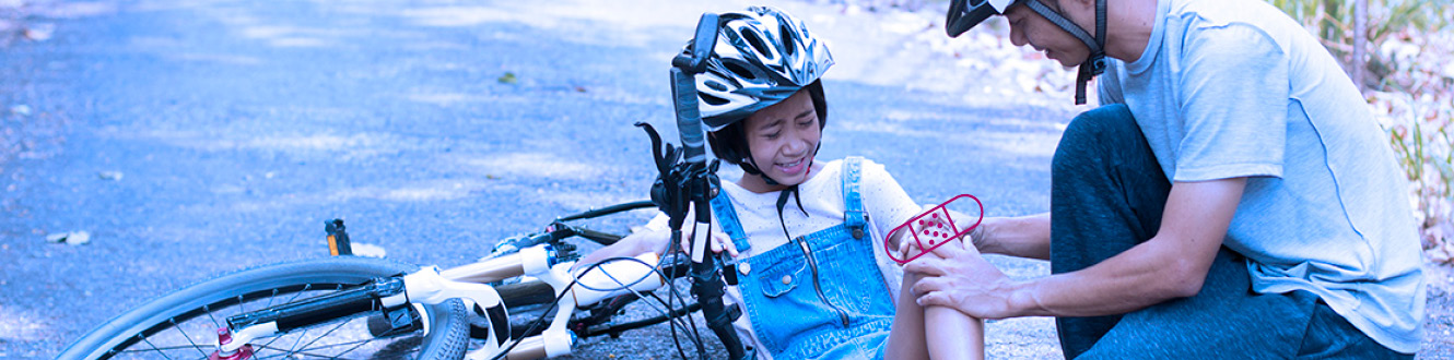 Child being tended to by an adult 