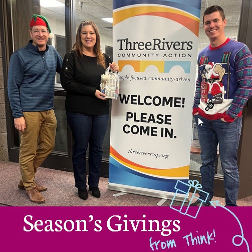 Two Think Bank employees providing a gift to Three Rivers Community Action.