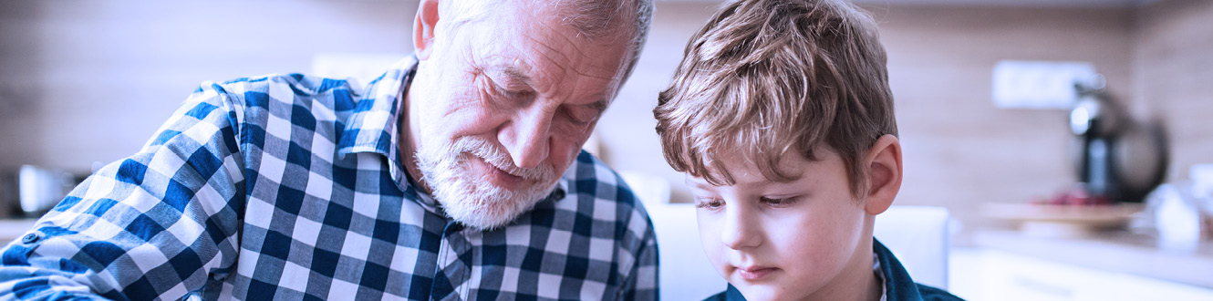 A grandparent and grandchild working together.